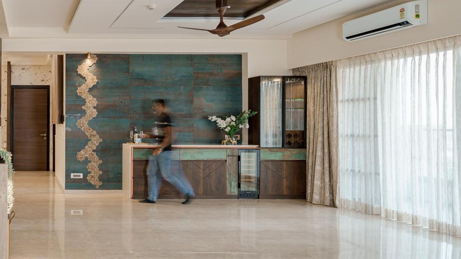 Yogesh walking through the living room